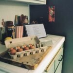 Carton of brown eggs on a kitchen counter